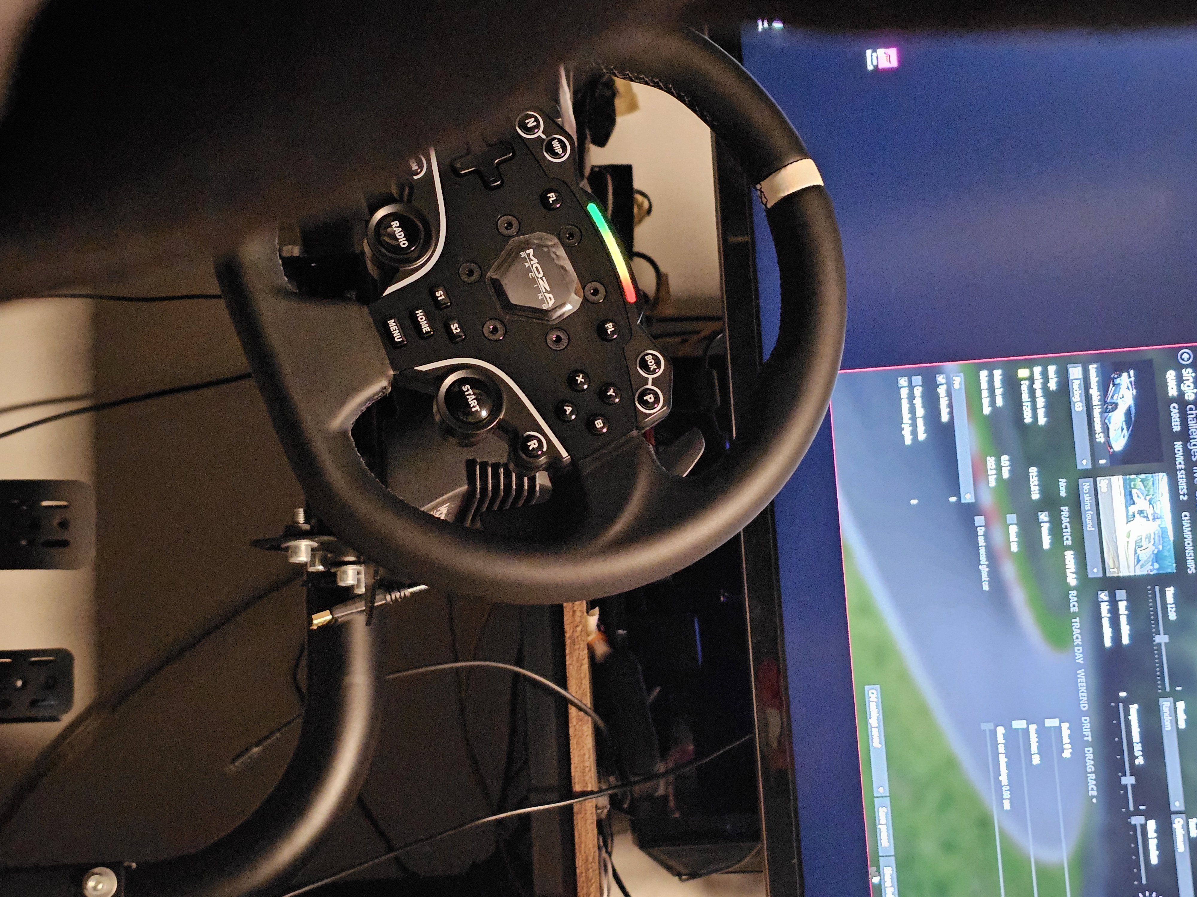 Sim racing equipment was looked at and gamer/driver was observed and asked about their preference in the buttons or interfaces they have available for their specific use and need case. This helped focus the attention on what is valuable to drivers in a real car. This is similar to how racing sim steer wheel is smaller and have more dedicated buttons for specific tasks. This is similar to actual formula race steering wheels, their design is intentional for a purpose. This was kept in my mind so that every functionality i make relates the physical world that provides the driver a service that they want and can see its result. The entire cockpit is condusive the the driver's experience and so the prototype was reworked to build that cockpit experience for testers. From module 2 it was also learnt that testers provided better response when they were more immersed into the curated test environment.