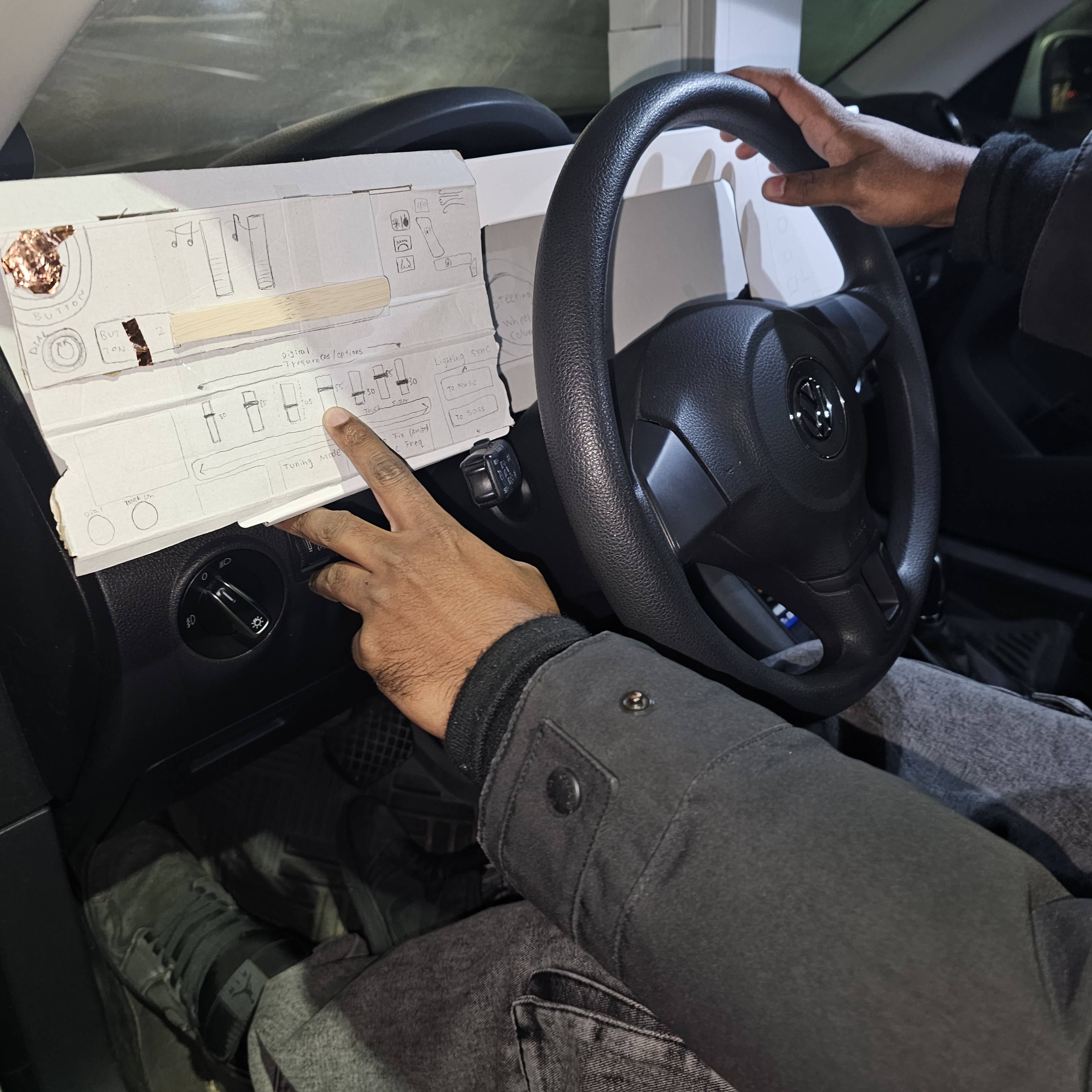 Testing ph physical interface and their proposed fucntions through roleplaying. Different layouts of interfaces were changed to test for different driver rteaction and preference. One preference noticed from 3 testers was the want to have main always using functions to be on the right hand dominant side and accesory or relaxing functions to be on the left hand side. LEss priority was given to the left side while driving and in parked. This provided an opportunity to explore what type of interfaces would fit in the two sides of the dash console and how they might be interacted best.